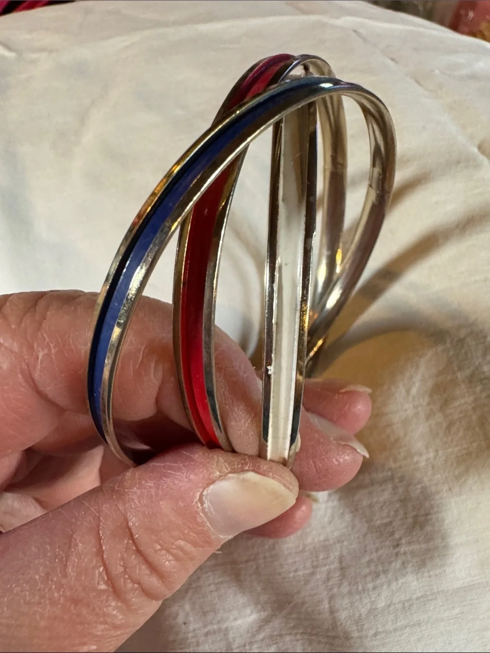 Napier Interlocked Goldtone Bangles with Red, White, and Blue Enamel Accents